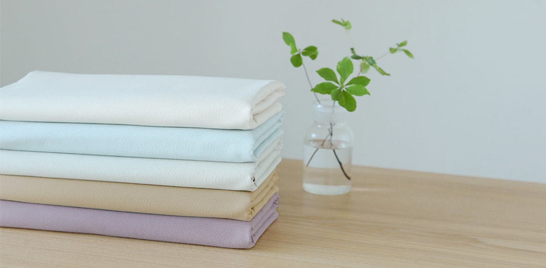 手間をかけて育てられたオーガニックコットン。人にも環境にも優しい素材は、温かく優しい手触り